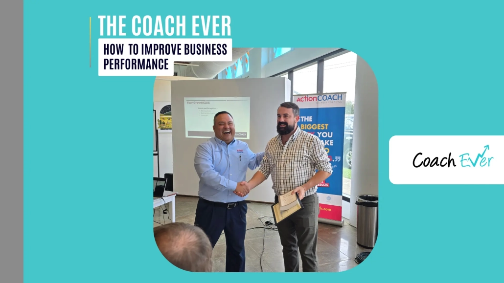 how to improve business performance: A business coach smiling and shaking hands with a client who holds a certificate in a bright workshop room
