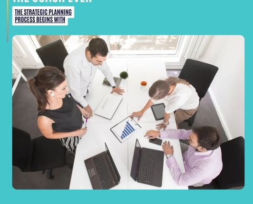 The Strategic Planning Process Begins With: a small team collaborating around a white table, reviewing charts and laptops during a focused planning session